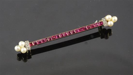 A 1920s/1930s French 18ct gold, ruby , diamond and seed pearl bar brooch by Lacloche Freres, Paris, 2in approx.